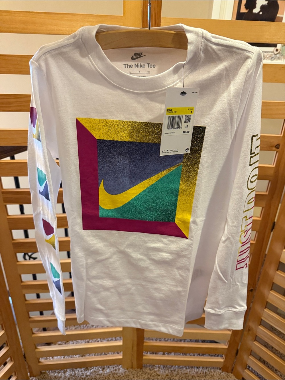 Nike White Long-Sleeve Graphic Tee with Yellow Swoosh and Multicolor Frame